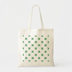Green cross stitches on white tote bag