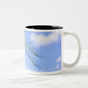 Green darner (Anax junius) flying against clouds Two-Tone Coffee Mug