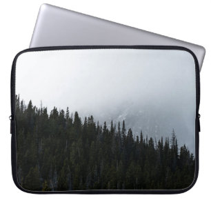 GREEN EVERGREEN TREES UNDER A CLOUDY SKY LAPTOP SLEEVE