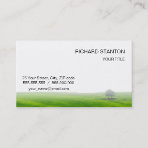 Green field with trees on it business card