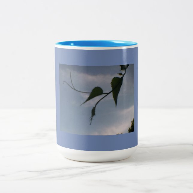 Green Foliage in Cloudy Blue Sky Two-Tone Coffee Mug (Center)