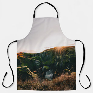 GREEN GRASS FIELD AND MOUNTAIN DURING DAYTIME APRON
