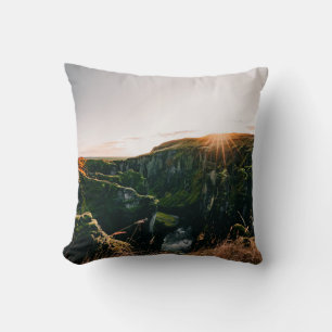 GREEN GRASS FIELD AND MOUNTAIN DURING DAYTIME CUSHION
