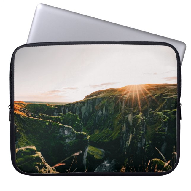 GREEN GRASS FIELD AND MOUNTAIN DURING DAYTIME LAPTOP SLEEVE (Front)