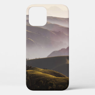 GREEN GRASS FIELD AND MOUNTAINS DURING DAYTIME iPhone 12 CASE