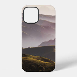 GREEN GRASS FIELD AND MOUNTAINS DURING DAYTIME iPhone 12 CASE