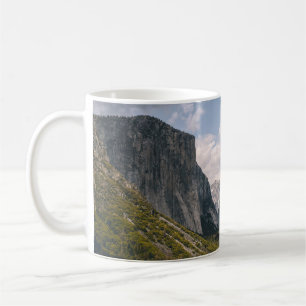 GREEN GRASS FIELD NEAR ROCKY MOUNTAIN UNDER WHITE COFFEE MUG