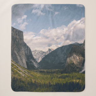 GREEN GRASS FIELD NEAR ROCKY MOUNTAIN UNDER WHITE SHERPA BLANKET