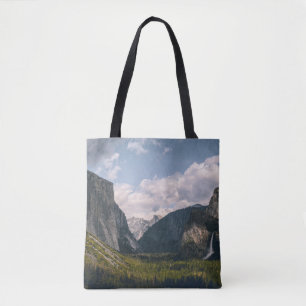 GREEN GRASS FIELD NEAR ROCKY MOUNTAIN UNDER WHITE  TOTE BAG