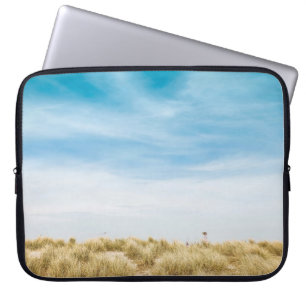Green grass field under blue skies laptop sleeve