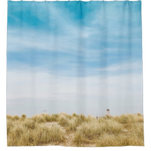 Green grass field under blue skies shower curtain