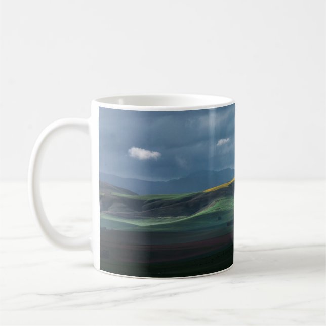 GREEN GRASS FIELD UNDER CLOUDY SKY DURING DAYTIME COFFEE MUG (Left)