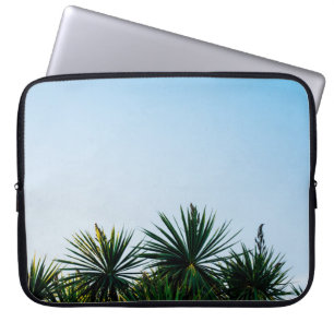 Green leaf plants under clear sky laptop sleeve