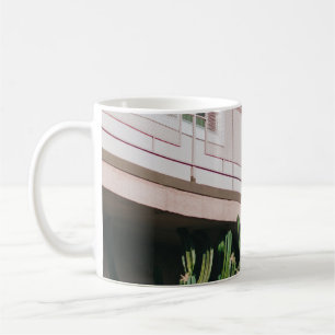 GREEN LEAFED PLANT NEAR BUILDING COFFEE MUG