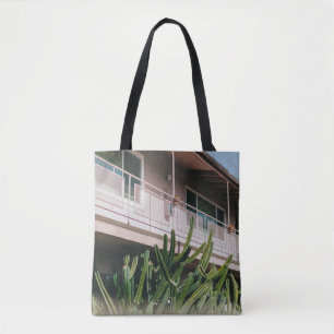 GREEN LEAFED PLANT NEAR BUILDING TOTE BAG