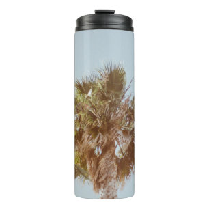 Green-leafed tree in the morning thermal tumbler