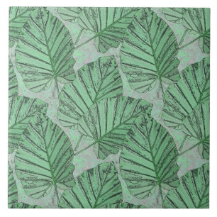 Green leaves on a grey stone. ceramic tile