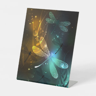 Green luminous dragonfly flight pedestal sign