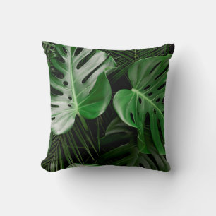 Green monstera leaves and palm leaves cushion