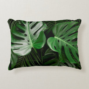 Green monstera leaves and palm leaves decorative cushion