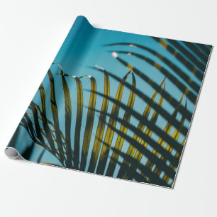 Green palm plant under blue sky in the morning wrapping paper