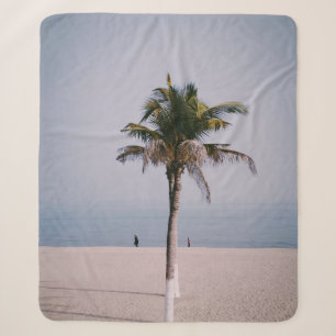 Green palm tree on seashore sherpa blanket