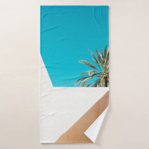 Green palm tree under blue sky in the morning bath towel