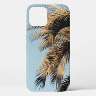 Green palm tree under blue sky in the morning iPhone 12 case