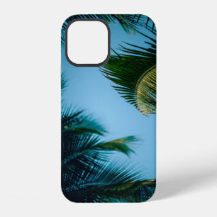 Green palm tree under blue sky in the morning iPhone 12 case