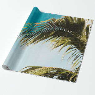 Green palm tree under blue sky wrapping paper