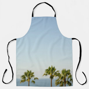 Green palm tree under white sky in the morning apron