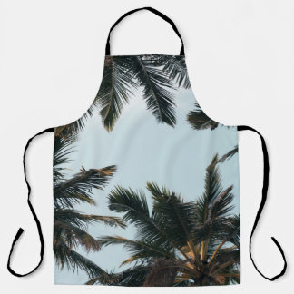 Green palm tree under white sky in the morning apron