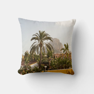 Green palm trees near brown concrete building in t cushion