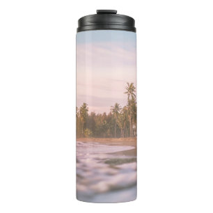 GREEN PALM TREES ON BROWN SAND UNDER WHITE CLOUDS THERMAL TUMBLER