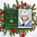 Green Photo Peace Joy Love Snowflake Gold Modern Holiday Card<br><div class="desc">“Peace, joy & love.” A fun, playful, gold foil and white snowflake illustration and modern typography on a rich, deep dark green marble watercolor background help you usher in the holiday season, along with the custom photo of your choice. Faux gold foil and white confetti dots frame the card. Feel...</div>