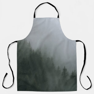 GREEN PINE TREES COVERED WITH FOG APRON