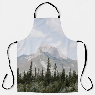 GREEN PINE TREES NEAR MOUNTAIN UNDER WHITE CLOUDS APRON