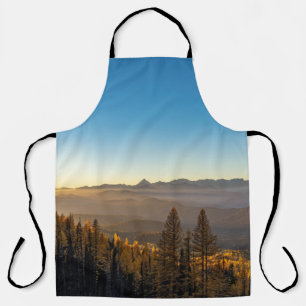 GREEN PINE TREES ON MOUNTAIN UNDER BLUE SKY DURING APRON