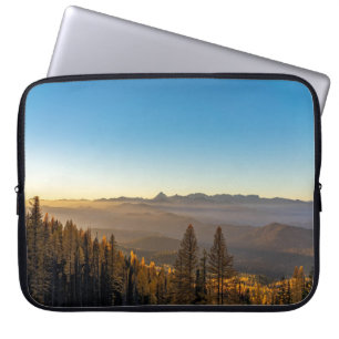 GREEN PINE TREES ON MOUNTAIN UNDER BLUE SKY DURING LAPTOP SLEEVE