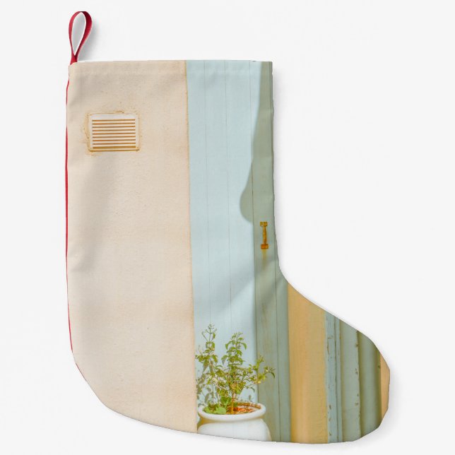 GREEN PLANT WITH CERAMIC VASE BESIDE WHITE WOODEN  SMALL CHRISTMAS STOCKING (Front)
