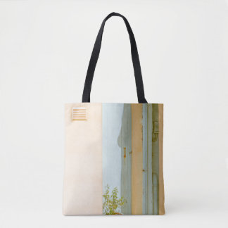 GREEN PLANT WITH CERAMIC VASE BESIDE WHITE WOODEN TOTE BAG