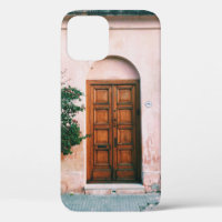 GREEN PLANTS BESIDE BROWN WOODEN DOOR