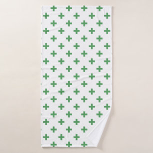 Green polka crosses on white bath towel