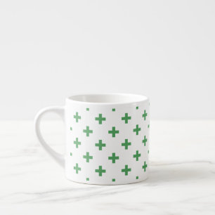 Green polka crosses on white espresso cup