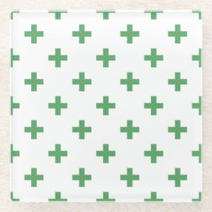 Green polka crosses on white glass coaster