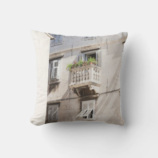GREEN POTTED PLANT ON BROWN CONCRETE HOUSE BALCONY CUSHION