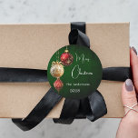 Green red gold baubles classic Christmas Classic Round Sticker<br><div class="desc">For a Christmas party favours or gift wrapping. A rustic green uneven coloured background. Decorated with red and gold baubles.  Personalise and add your name,  year.  Text: Merry Christmas</div>