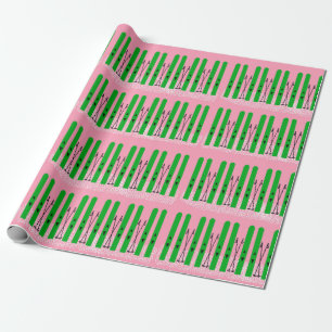 Green skis with pink wrapping paper