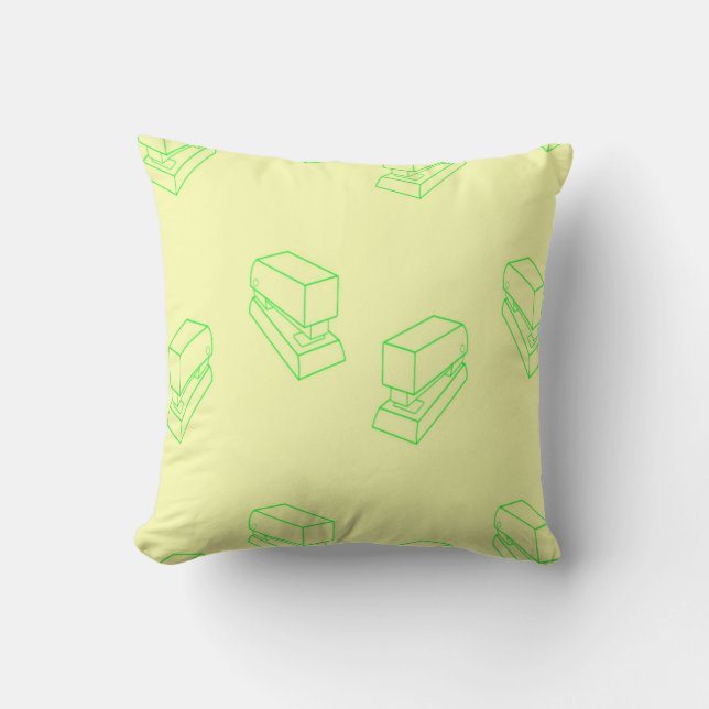 Green stapler on yellow cushion (Front)