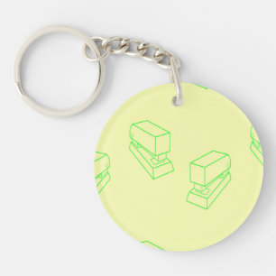 Green stapler on yellow key ring